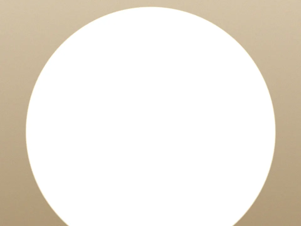 Smartphone lying on wooden table showing a session-limit slider with clock icon